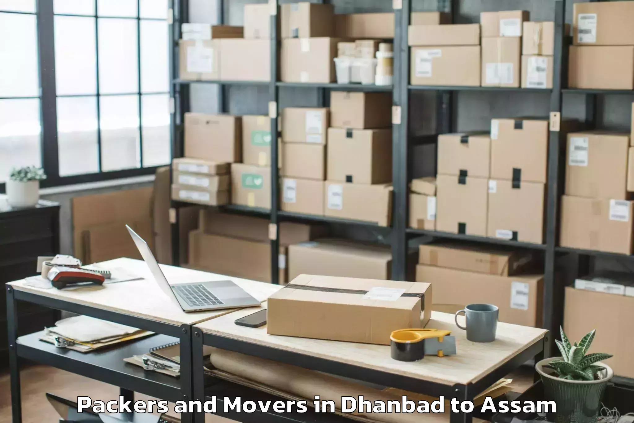 Trusted Dhanbad to Sonabarighat Packers And Movers